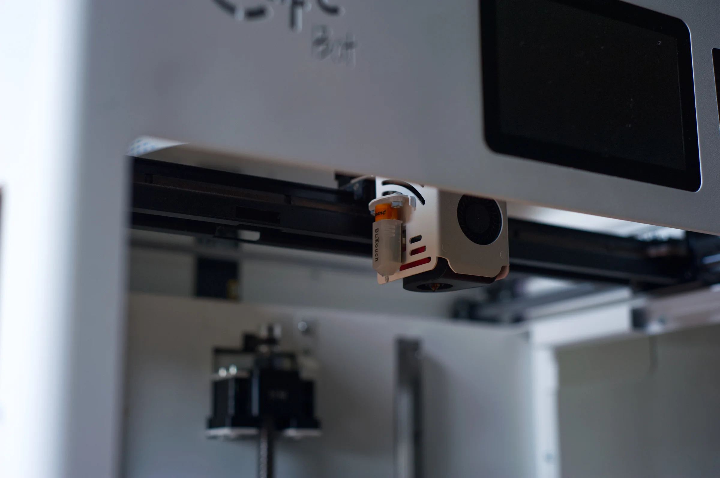 FDM 3D printer creating a part layer by layer